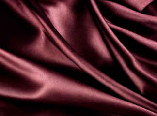 The image shows a close-up of a dark, maroon-colored fabric with soft folds and a smooth texture, likely satin or silk.The fabric appears elegant and is well-lit generative AI