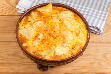 Prepared potato casserole with crust of melted cheese on top