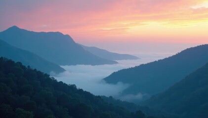 Fototapeta premium Ethereal fog rolls in over a misty mountain range at dawn, mystical, atmospheric
