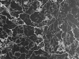 Dark marble background with striking white veins and intricate patterns.