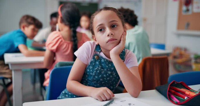 Girl, preschooler and child thinking in classroom with books, education and learning development. ADHD, kid and bored female student daydreaming for lesson, ideas and knowledge in artistic assessment