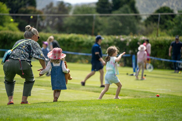 children play grass tennis in a lawn tennis court learning and having fun