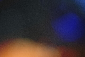 The image shows a blurred background with a gradient of colors. The left side is dark green, and the right side transitions to a bright orange. The overall effect is soft and dreamy.
