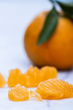Portrait photos of ripe orange's slices in focus and orange in bokeh