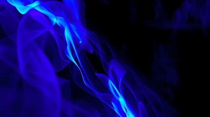 Fototapeta premium Ethereal Blue Smoke: Abstract and captivating display of ethereal blue smoke plumes, dancing gracefully against a contrasting black background. 
