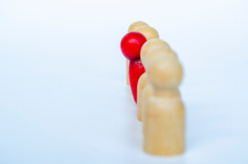 A red wooden figure speaking up. Representing satisfaction or happy with something