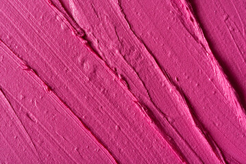 Closeup of pink glossy lipstick texture