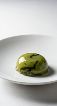 Minimalist Green Dessert with Seaweed on a White Plate, simple and elegant