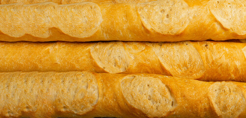 French baguette texture background, long bread loaf pattern, fresh cereal detailed buns banner