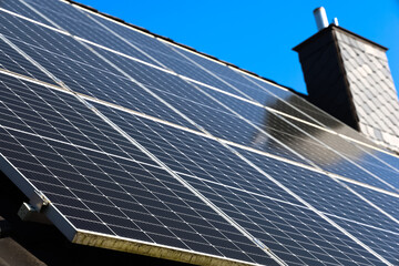 Solar panels converting sunlight into renewable energy on rooftop