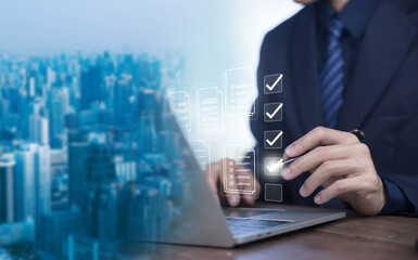 Business performance checklist, Take an assessment business man, Businessman using laptop online an...