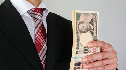 100万円を持つビジネスマン