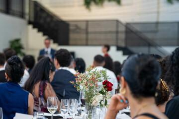 people watching at an event inside
