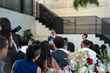 Fototapeta premium people watching at an event inside