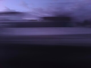 Selective focus photography. A frame in motion. Abstract background. Colorful image. Long shutter speed. Light streaks. Movement of transportation. Shooting from transportation. Blurred image