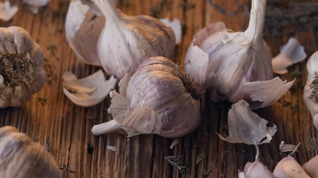 Garlic bulbs on a wooden table, close up view