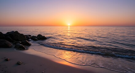 Obraz premium Serene Beach Sunrise with Crystal Clear Water
