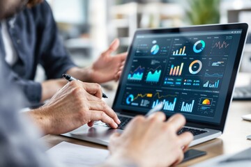 Business team analyzing financial data on laptop in modern office.