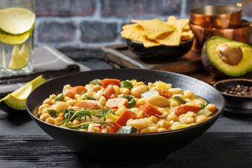 white bean chickpea chili with sausages, zucchini