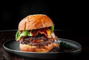 A delicious gourmet burger featuring a juicy beef patty, crispy bacon, cheddar cheese, fresh...