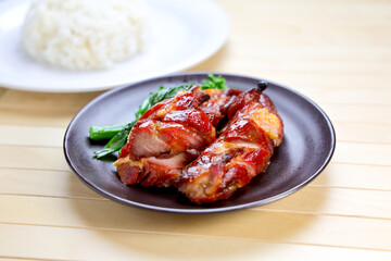 Barbecued Pork with Rice served in plate isolated on table side view of Hong Kong food