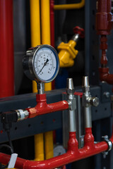 Monitoring pressure levels in industrial pipe system at a facility