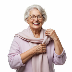 A cheerful senior woman with gray hair, wearing glasses and a light mauve/lilac colored sweater and matching scarf, is depicted against a plain white background.