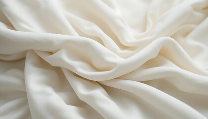 Fototapeta premium A close-up of a soft, off-white fabric draped in gentle folds, highlighting its subtle texture and lightweight, airy quality. The material appears slightly crinkled, adding depth and visual interest