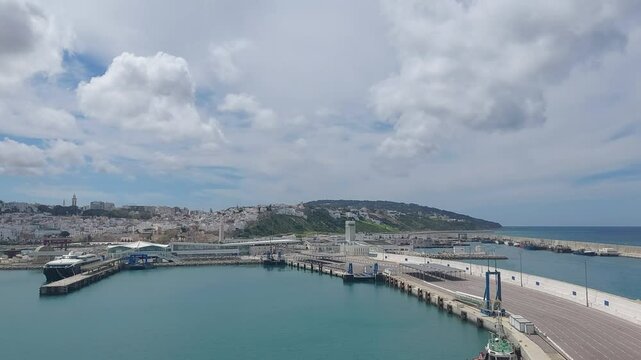Moroco tangier apr 26 2024 Scenic View of Tangier Port and Cityscape Under Cloudy Skies