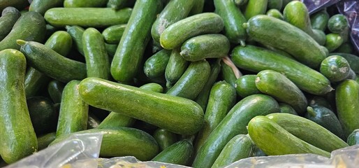 Pile of Fresh, Green Cucumbers at Market