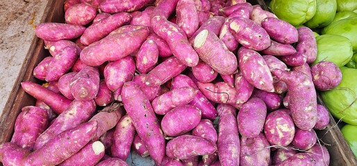 Pile of Purple Sweet Potatoes at Market