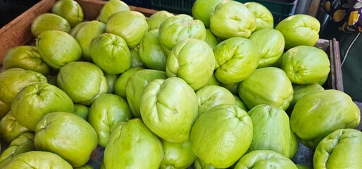 Pile of Chayote Squash in a Wooden Box