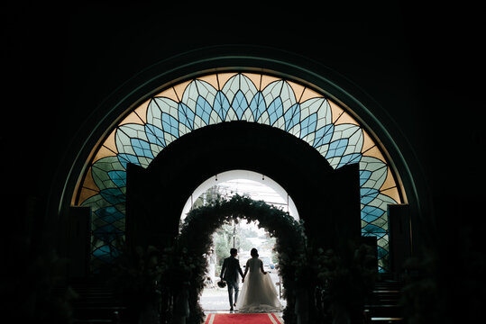 Silhouette of a Couple Inside a Church