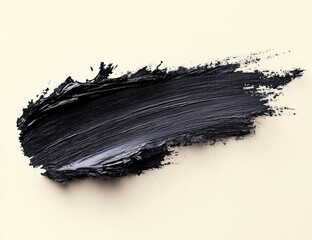 Abstract black paint stroke on a beige background, showcasing texture and artistic flair