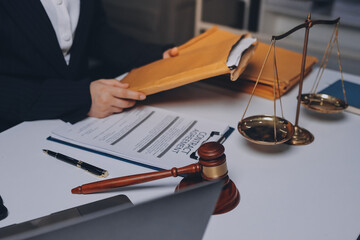 Judge gavel with Justice lawyers having team meeting at law firm background. Concepts of Law and...