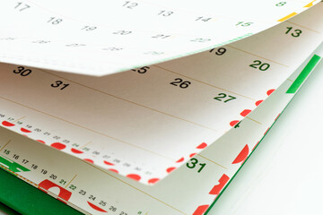 Closeup view of calendar pages showing days and dates for planning activities and events
