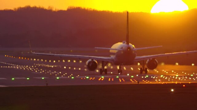 Passenger plane takes off at sunset, marking the beginning of an exciting journey