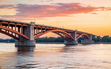 Naklejka premium Mississippi River, Sunset view of a red bridge over a river