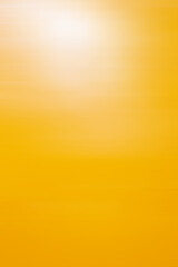 A spot of sun glare on the yellow surface of the plastic panel.
