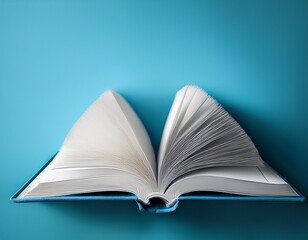 open book on light blue surface with bold empty copy space for educational concepts and knowledge exploration minimalist design high angle view