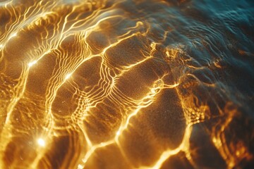 Golden sunlight refracting through shallow water, creating mesmerizing patterns on the sandy seabed.
