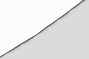 Abstract image of a torn piece of white paper on a gray background, suggesting a concept of contrast and division