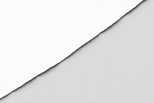 Abstract image of a torn piece of white paper on a gray background, suggesting a concept of contrast and division
