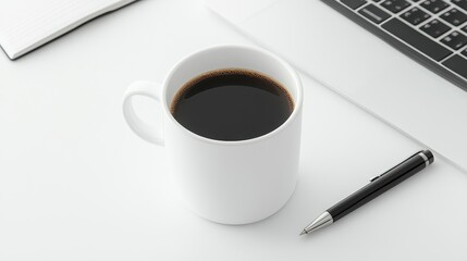 A white mug of black coffee sits on a white desk next to a black pen and keyboard. Clean and simple composition
