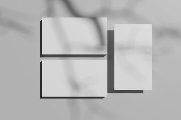 Blank business cards on light grey background. Mockup for design