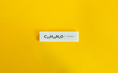 Fentanyl, C₂₂H₂₈N₂O. Text on Block Letter Tile on Yellow Background. Minimal Aesthetic.