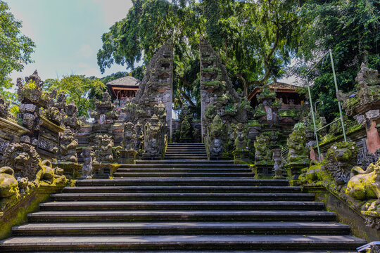 Ubud in the Island of Bali is a very historical and religious cultural city with statues of Hindu Gods and ornate decorated buildings and doors. Balinese revere their gods in Bali Indonesia 
