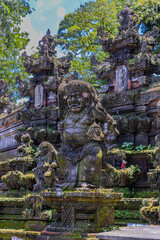 Fototapeta premium Ubud in the Island of Bali is a very historical and religious cultural city with statues of Hindu Gods and ornate decorated buildings and doors. Balinese revere their gods in Bali Indonesia 