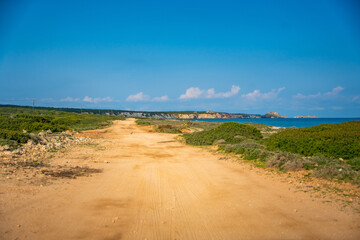 A winding road leading to the northeasternmost cape of Northern Cyprus. The image represents exploration, adventure, and the journey through untouched Mediterranean landscapes