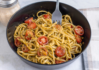 spaghetti with pesto and tomatoes
